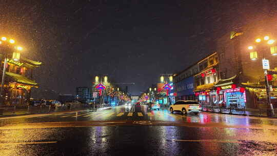 山西大同古城鼓楼夜景飘雪下雨雪景