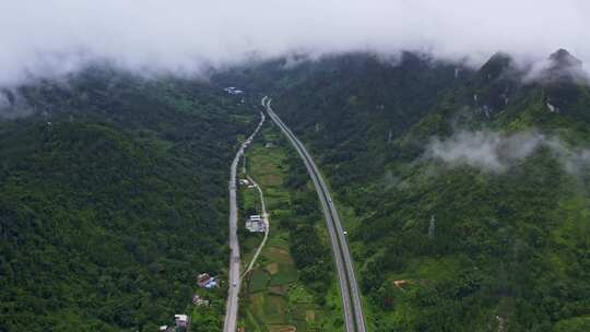 航拍云雾山川乡村道路高速公路