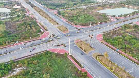 晴天航拍惠州城市十字道路车流环绕延时