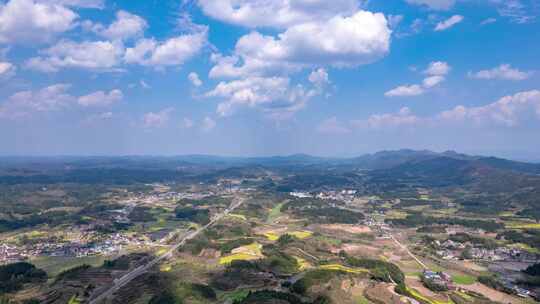 丘陵山川农田蓝天白云航拍延时8K