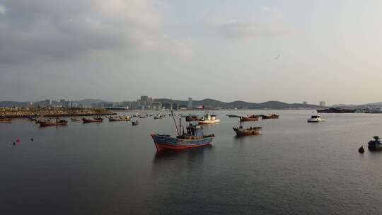 航拍沿海城市海上渔船场景