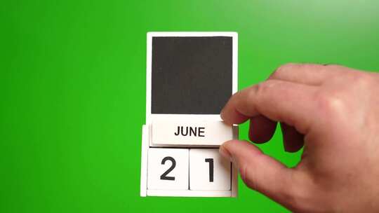 06.绿色背景上日期为6月21日的日历。视频素材模板下载