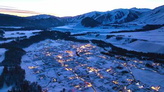 新疆阿勒泰禾木雪山航拍延时日转夜