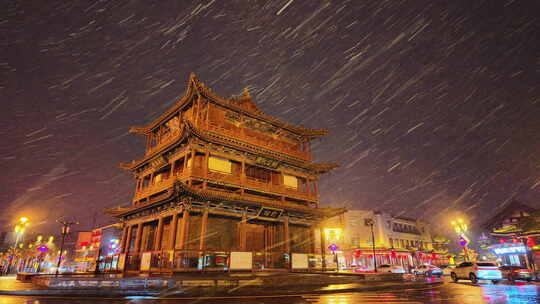 山西大同古城鼓楼夜景飘雪下雨雪景