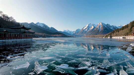 冬季湖面结冰雪山古建筑景观