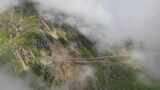 航拍云雾缭绕的川西巴朗山垭口高山草甸风光高清在线视频素材下载
