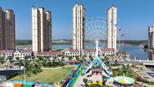 航拍威海荣成那香海景区的摩天轮与高楼