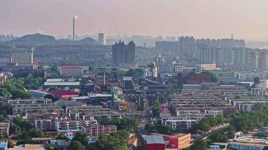 河北唐山南站城市中火车轨道与建筑鸟瞰全景