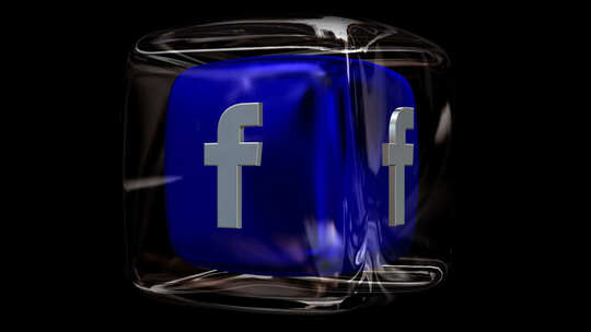 在玻璃立方体中旋转Facebook徽标，