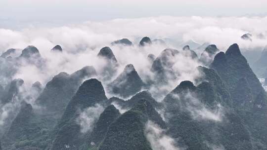 航拍桂林云海下的山峰