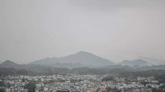 安徽省黄山市屯溪区夏季远山的云和雨