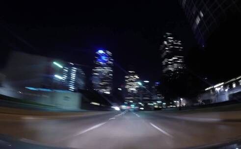 驾驶室视角行车记录仪城市夜晚交通灯光延时