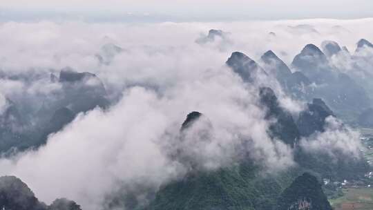 航拍桂林云海下的山峰