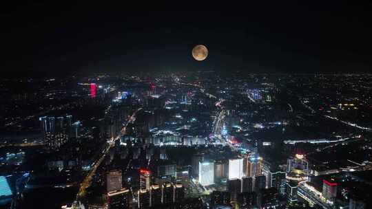 十五的夜晚城市月亮升起中秋节城镇夜景风光