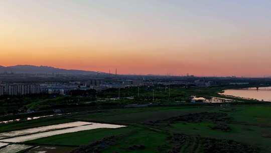 航拍夕阳下宁夏石嘴山惠农区城市风光