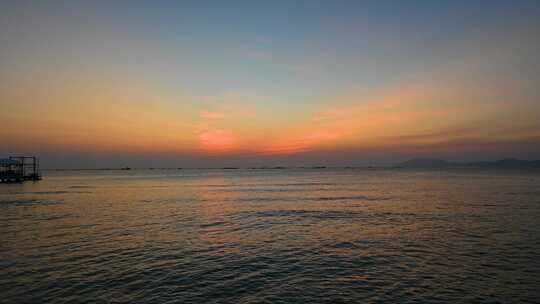海南三亚傍晚海边夕阳晚霞椰树海浪