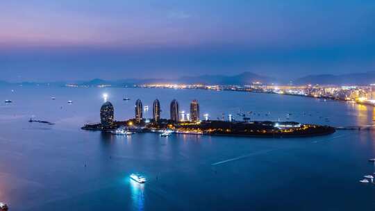 中国海南三亚三亚湾凤凰岛夜景延时摄影