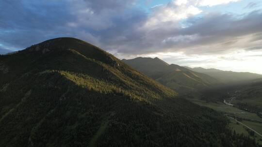 航拍格聂神山草原落日夕阳晚霞