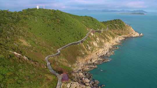 航拍海南三亚西岛海洋文化旅游区海浪礁石