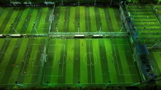 航拍城市夜晚灯光足球场运动比赛的人视频素材模板下载