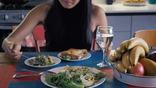 girl-eating-salad-in-her-kitchen