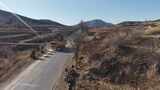 山间蜿蜒公路航拍景象高清在线视频素材下载