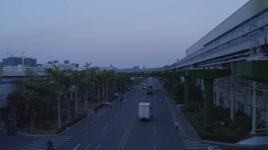 航拍深圳比亚迪新能源汽车厂公路 黎明行车