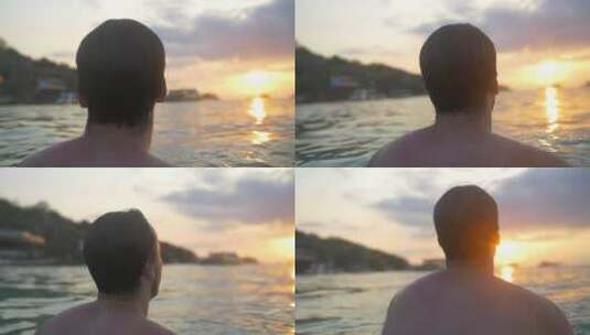 日落时眺望大海的游泳者高清在线视频素材下载