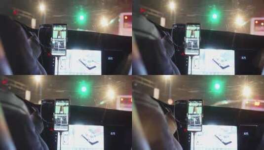 网约车司机按手机导航APP行驶在夜晚城市高清在线视频素材下载