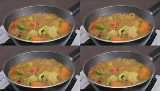 不粘锅煮咖喱青椒胡萝卜土豆牛肉高清在线视频素材下载