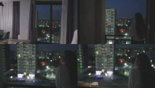 年轻女人在阳台栏杆欣赏城市夜景高清在线视频素材下载