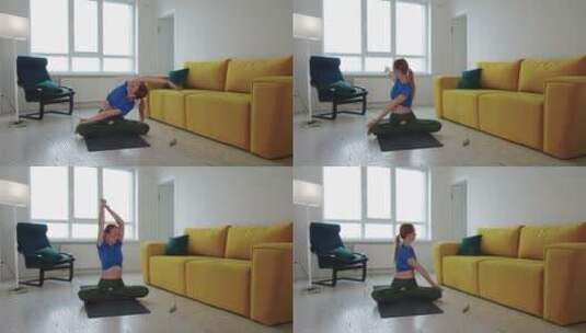 女人在瑜伽垫上热身高清在线视频素材下载