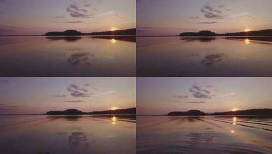夕阳西下唯美波光粼粼的湖泊森林落日湖面高清在线视频素材下载