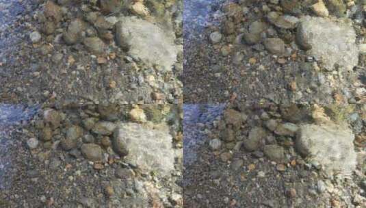 清澈见底的水面和水底的鹅卵石高清在线视频素材下载
