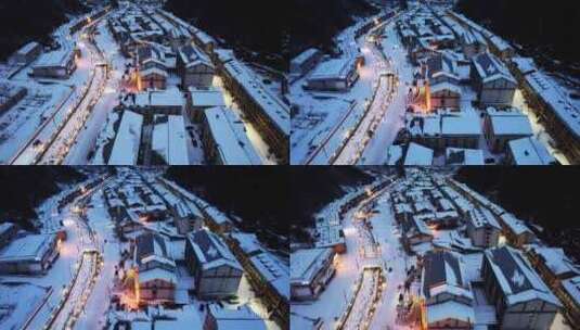 航拍冬天雪景山谷村庄交通道路灯光夜景高清在线视频素材下载