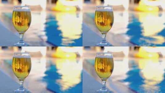 泳池边的啤酒杯高清在线视频素材下载