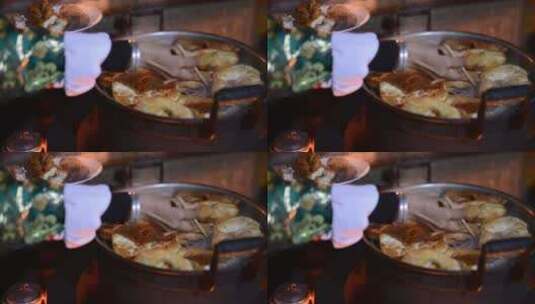 筷子夹起蒸锅里的食物高清在线视频素材下载