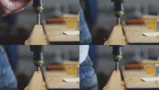 木匠用电钻在木板上钻孔高清在线视频素材下载