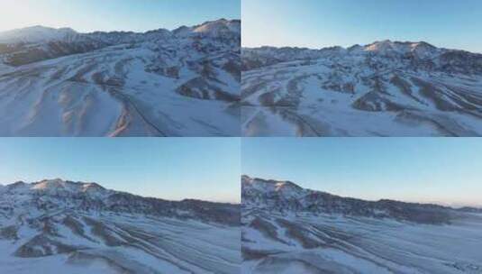 航拍冬季新疆赛里木湖雪山冰湖蓝冰日照金山高清在线视频素材下载