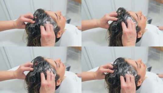 理发师清洗一个放松女人的头发高清在线视频素材下载