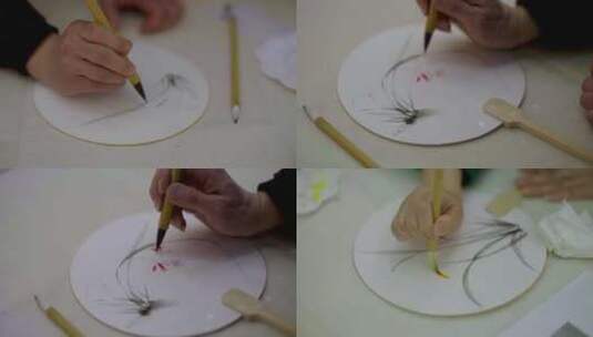 画家在纸扇上作画高清在线视频素材下载