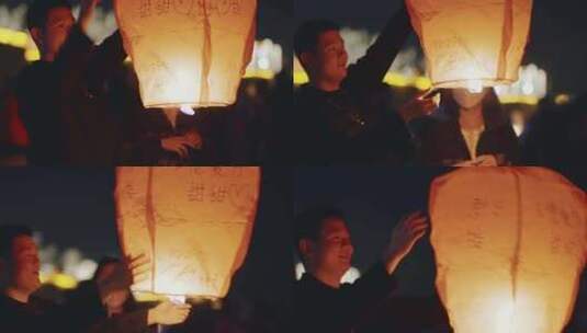 夜晚年轻人放孔明灯高清在线视频素材下载