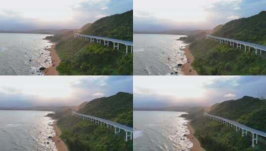 航拍海边日落天空海边的沿山公路三亚高清在线视频素材下载