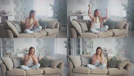 女人在家庆祝在智能手机上赢得在线游戏高清在线视频素材下载