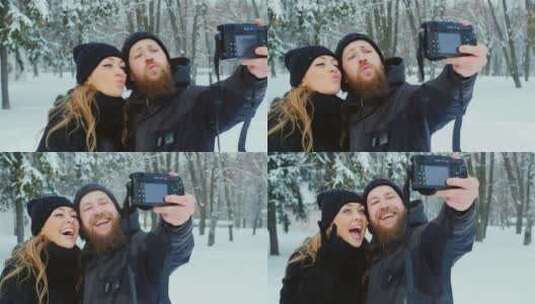 俏皮的年轻夫妇在雪地里自拍高清在线视频素材下载