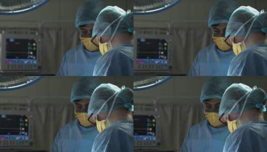 外科医生抬头观察医疗仪器高清在线视频素材下载