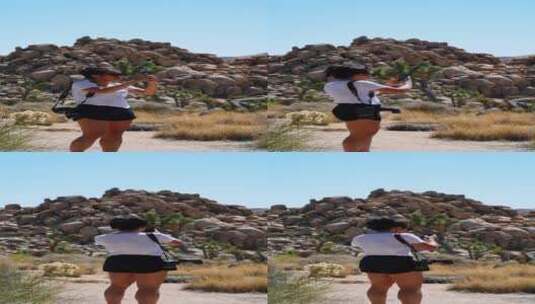 女人用手机拍遍沙漠周围高清在线视频素材下载
