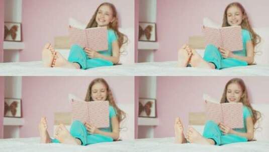 在床上看书的快乐女孩高清在线视频素材下载