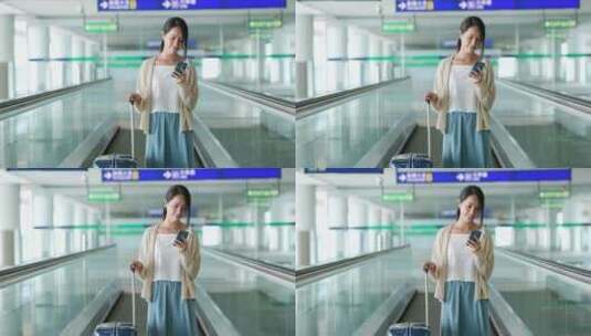 妇女在机场扶梯上使用手机高清在线视频素材下载