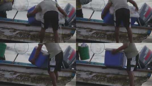 渔民将捞的货物从船上卸下来高清在线视频素材下载